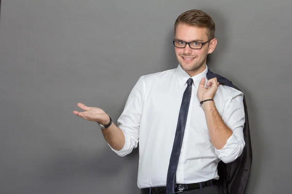 A handsome young businessman wearing glasses and smiling. Vertic — Stock Photo, Image