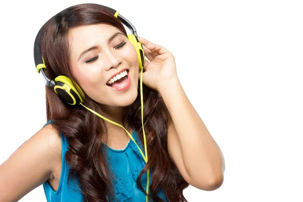 Young  woman sing while listening to music with headphone, isola — Stock Photo, Image