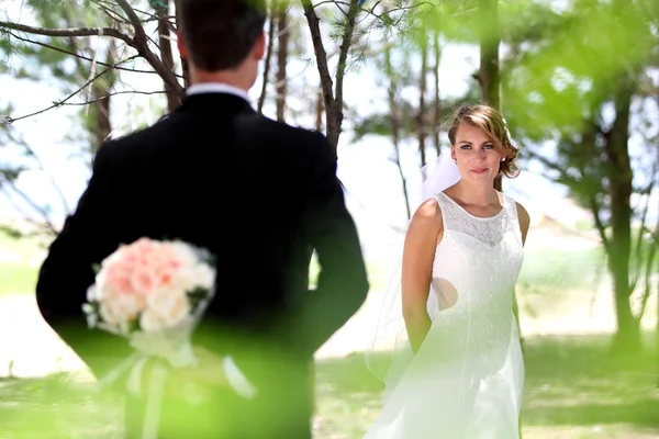 Beautiful bride looking at her groom — Stock Photo, Image