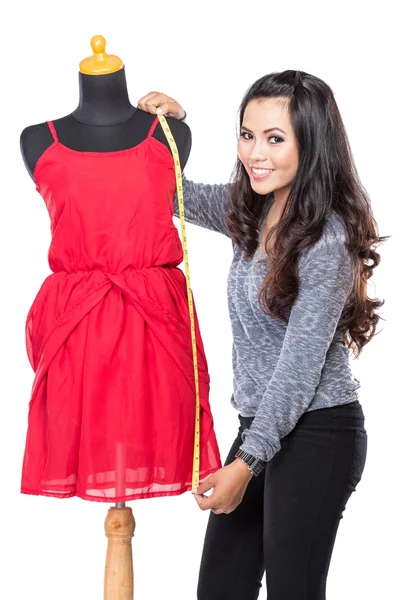 Young asian designer woman measuring and smiling,  look at the c — Stock Photo, Image
