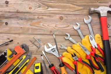 mechanical kit in wooden background. construction tool