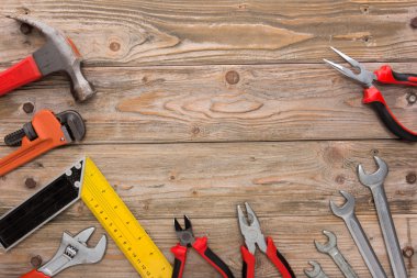 mechanical kit in wooden background. construction tool