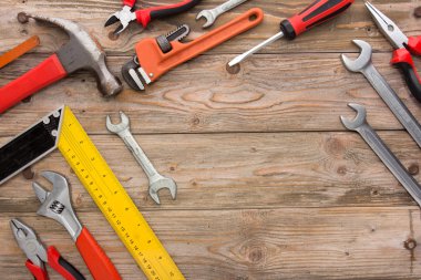 Mechanical kit in wooden background. construction tool