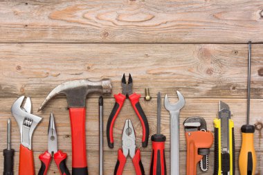 mechanical kit in wooden background. construction tool