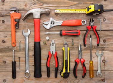 mechanical kit in wooden background. construction tool