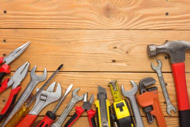 mechanical kit in wooden background. construction tool with a co