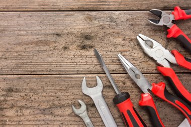 mechanical kit in wooden background. construction tool with a co