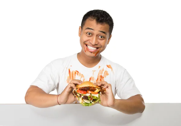 Jovem tem um grande desejo de comer um hambúrguer — Fotografia de Stock