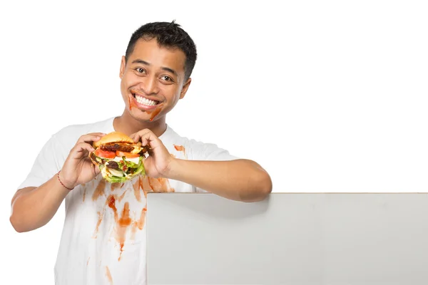 Young man have a great desire to eat a burger — Stock Photo, Image