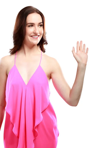Schöne Frau lächelt und winkt mit der Hand — Stockfoto