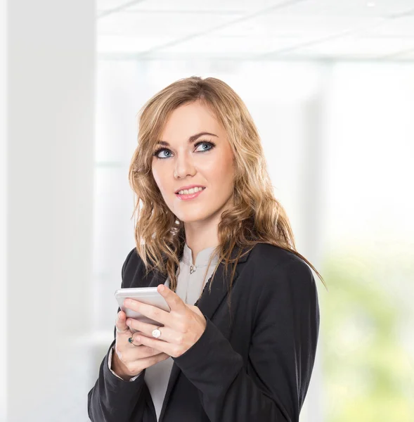 Business woman thinking while use communicator, write send messa — Stock Photo, Image