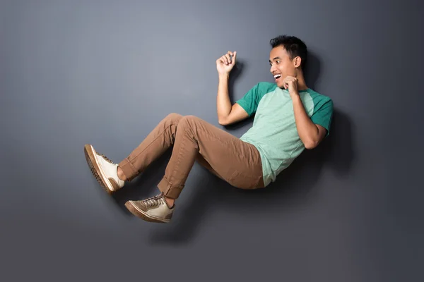 Young man floating and act like fall over — Stock Photo, Image