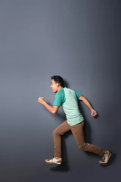 Young man running in the air — Stock Photo, Image