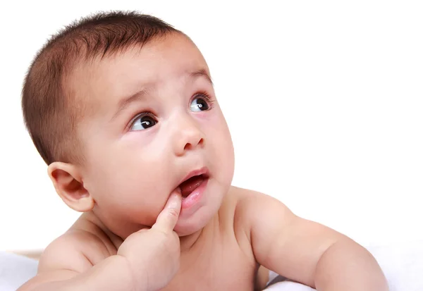 Cute baby with finger in his mouth — Stock Photo, Image