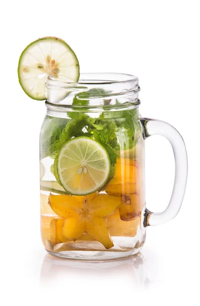 Infused fresh fruit water of starfruit, mint and lime. isolated — Stok fotoğraf