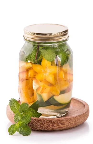 Infused fresh fruit water of mango, starfruit and mint.isolated — ストック写真