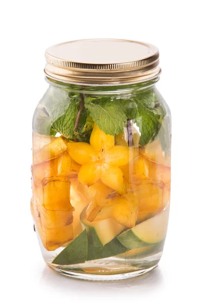 Infused fresh fruit water of mango, starfruit and mint.isolated — ストック写真