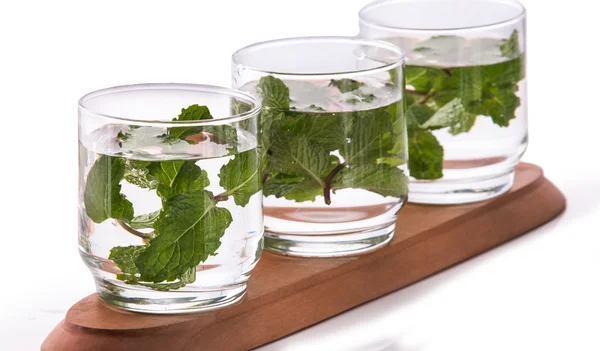 Infused fresh fruit water of mint leaf. isolated over white — Stok fotoğraf