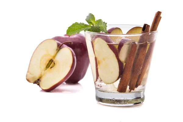 Infused fresh fruit water of apple and cinnamon. isolated over w — Stock fotografie