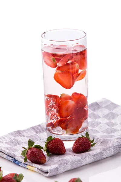 Infused fresh fruit water of strawberry. isolated over white — ストック写真