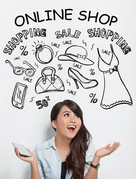 Beautiful asian woman holding a handphone while imagining about — Stock Photo, Image