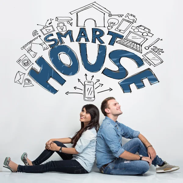 Mixed couple imaginating about smart house system, ilustrated th — Stock Photo, Image