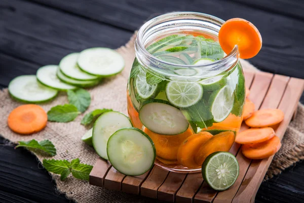 Infused water mix of  cucumber, carrot, and lime — Stock Photo, Image
