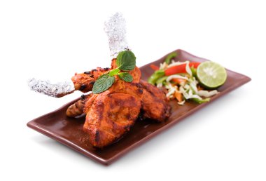 delicious, indian tandoori chicken served with salad clipart