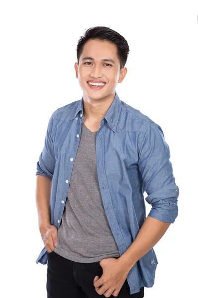 Young asian man posing hands on the waist, smile to the camera — Stock Photo, Image