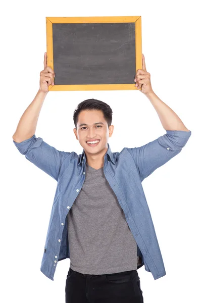 Jovem asiático homem segurando blackboard no fundo branco — Fotografia de Stock