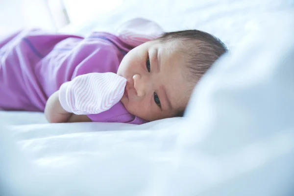 Newborn on the bed — Stock Photo, Image