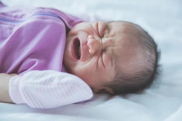 One week old crying baby in a blanket — Zdjęcie stockowe