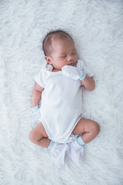 Newborn on the bed — Stock Photo, Image