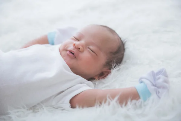 Newborn on the bed — Stock Photo, Image