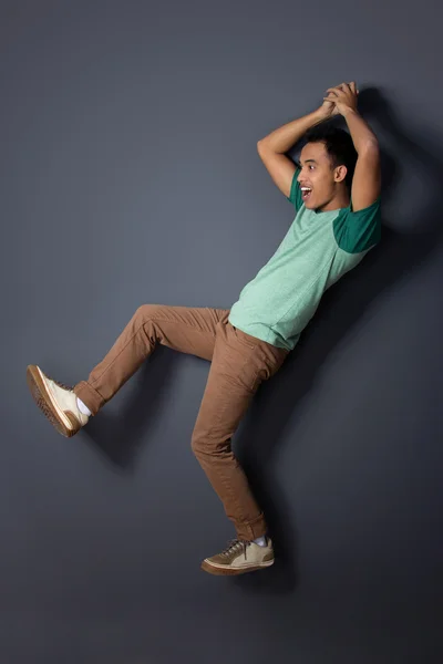 Young man posing falling — Stock Photo, Image
