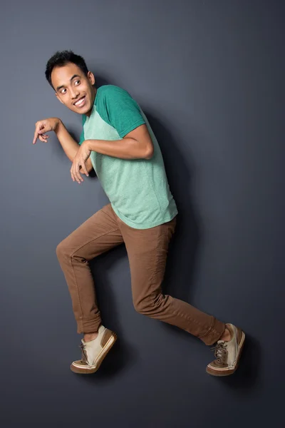 Young man walk tip toeing — Stock Photo, Image