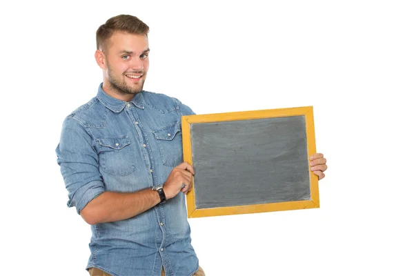 Jonge man met een schoolbord, glimlachend — Stockfoto