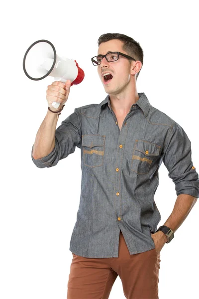 Jovem grita com um megafone — Fotografia de Stock