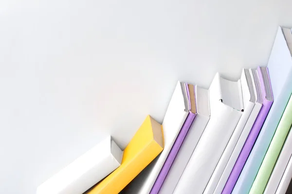 Row of books on white background — Stock Photo, Image