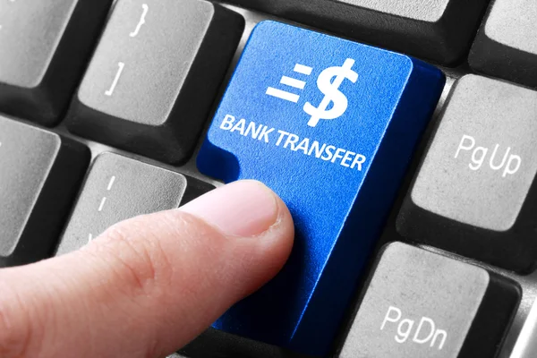 Hand press bank transfer button on keyboard — Stock Photo, Image