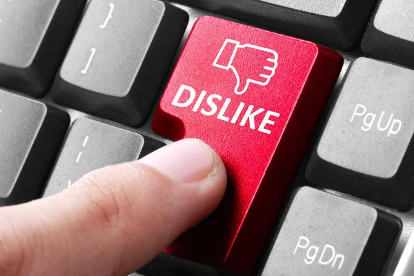 Hand press dislike button on keyboard — Stock Photo, Image