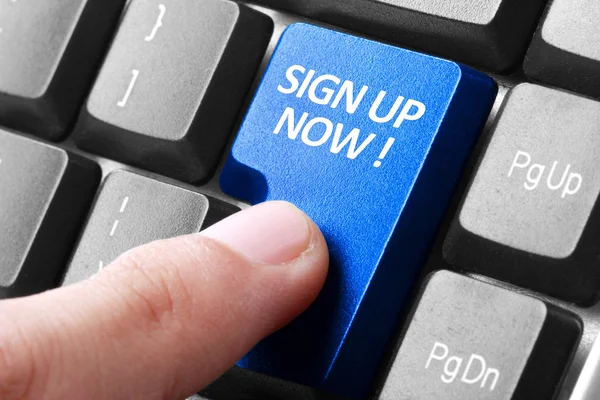 Hand press sign up now button on keyboard — Stock Photo, Image