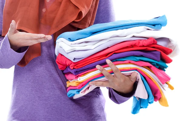 Hands presenting clean and tidy folded clothes after ironing — Stock Photo, Image