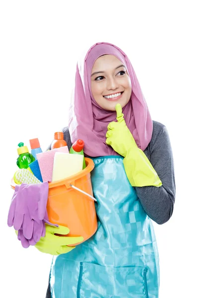 Young woman wearing hijab thinking while holding a bucket full o — Stock Photo, Image