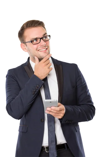 Businessman holding a cellphone, grinning and look up Stock Picture