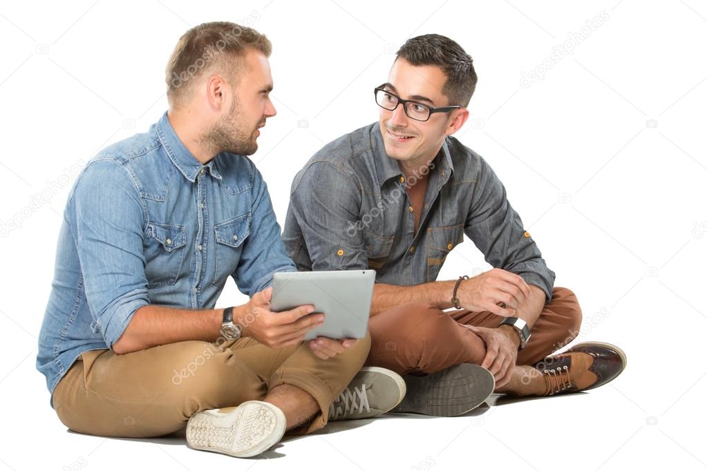 young men looking at a tablet pc