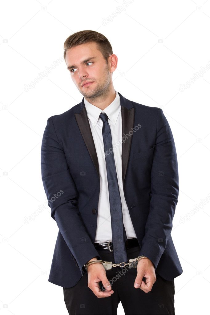 Businessman with both hand handcuffed