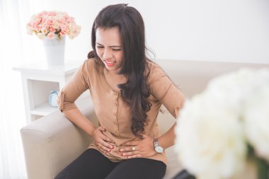 women feeling unwell on her stomach clipart