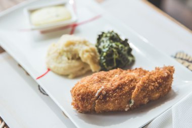 Chicken Cordon-bleu with mashed potato  and green vegetable