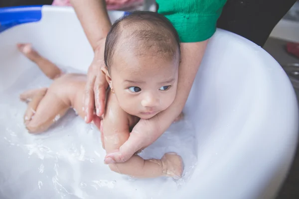 Bathing baby in a tub outdoor — Stock Photo, Image